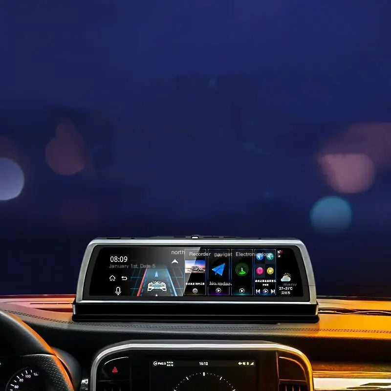 Car dashboard with a digital display showing various icons and information against a blurred night-time background.