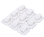 White silicone mold with multiple compartments on a white background