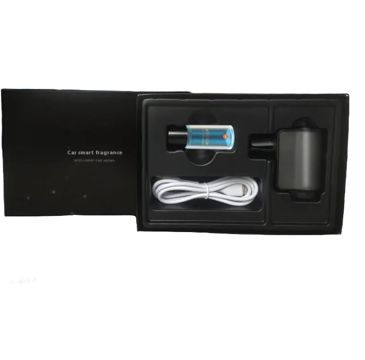 Car smart fragrance set with essential oil, machine, and cable in a black gift box on a car dashboard.